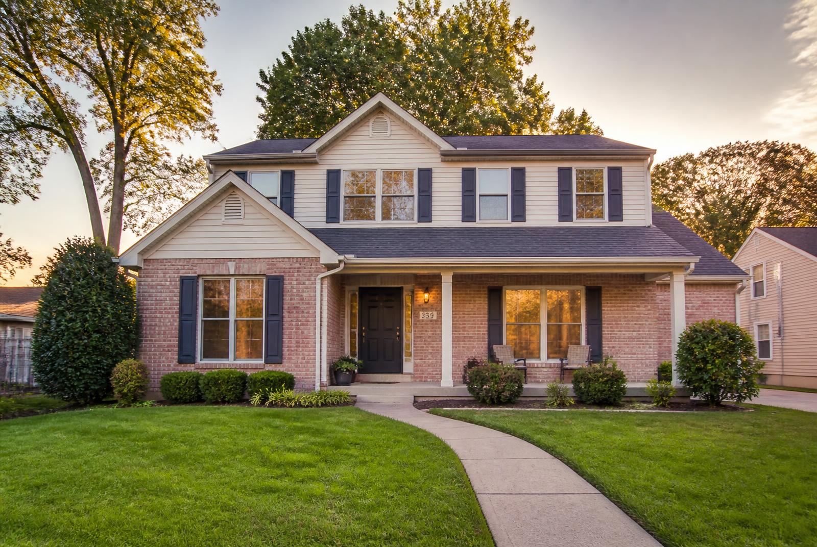 A welcoming suburban home with a brick facade